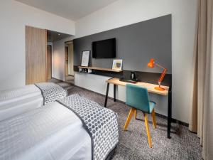 Postel nebo postele na pokoji v ubytování Clarion Hotel Vienna South