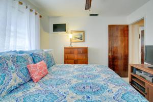 a bedroom with a bed and a television at St Petersburg Home with Tropical Yard and Pool! in St Petersburg