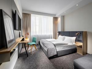 Postel nebo postele na pokoji v ubytování Clarion Hotel Vienna South