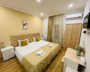 Postel nebo postele na pokoji v ubytování Hotel Art Green