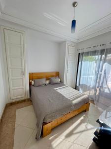 Ένα ή περισσότερα κρεβάτια σε δωμάτιο στο Villa piscine privée sans vis-a-vis,35km Agadir +9 φωτογραφίες