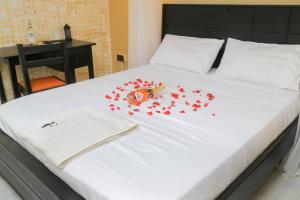Postel nebo postele na pokoji v ubytování Fuego Hotel
