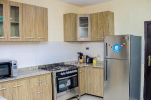 Η κουζίνα ή μικρή κουζίνα στο 4 Bedroom all ensuite "Milk & Honey" Home in Adeniyi Jones Ikeja