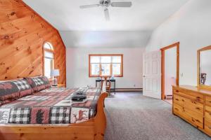 a bedroom with a bed and a wooden ceiling at Cozy Villager Chalet w Mountain Views and Firepit in Dover