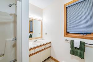 a bathroom with a sink and a mirror and a window at Cozy Villager Chalet w Mountain Views and Firepit in Dover +63 photos