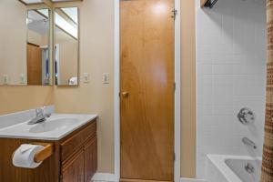a bathroom with a sink and a shower at Stratton's Crown Point Mountain Views, Top Floor newlly furnished in Stratton +19 photos