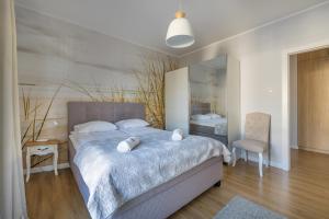 Posteľ alebo postele v izbe v ubytovaní Amber Baltic Apartment + 21 fotografií