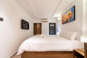 Postel nebo postele na pokoji v ubytování Thuan Phat Hostel
