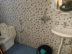 a bathroom with a toilet and a sink at Mountain View Hillside Homestay Kalimpong, Between Silk Route- Deolo Park- Ramdhura in Kalimpong