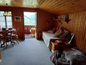 a bedroom with a bed and a table in a room at Chalet Bel Horizon in Saint-Martin