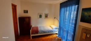 Postel nebo postele na pokoji v ubytování Appartamento ALICE