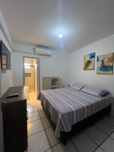 Postel nebo postele na pokoji v ubytování Casa na Praia Frente Mar 02