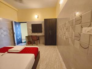Postel nebo postele na pokoji v ubytování Mayura Inn