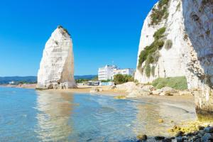 a view of a beach with two large rocks at Residence San Luca Vieste in Vieste