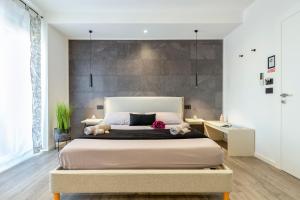 a bedroom with a large bed in a room at saige holidays in Alghero