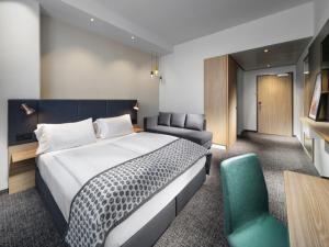 Postel nebo postele na pokoji v ubytování Clarion Hotel Vienna South
