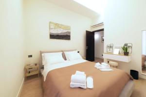 Postel nebo postele na pokoji v ubytování Guli's Suite - Lusso e Comfort in Centro Storico