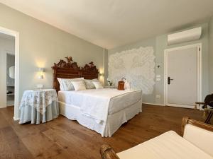 Postel nebo postele na pokoji v ubytování B&B Carmen Garden