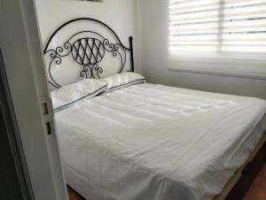 Кровать или кровати в номере Vivienda Vacacional La Candelaria II