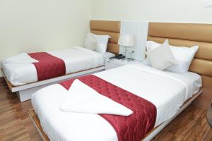 Ліжко або ліжка в номері Hotel Priority A Unit of Priority Hospitality