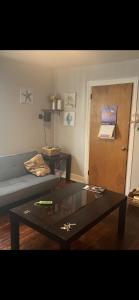 a living room with a couch and a coffee table at BVF2Bedroom in Harrisburg