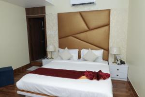 Ліжко або ліжка в номері Hotel Priority A Unit of Priority Hospitality