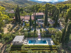 an aerial view of a house with a pool and trees at Corinthian Blue Retreat in Katakoúli
