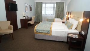 Ένα ή περισσότερα κρεβάτια σε δωμάτιο στο Hotel Class