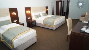 Ένα ή περισσότερα κρεβάτια σε δωμάτιο στο Hotel Class