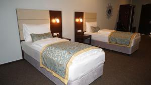 Ένα ή περισσότερα κρεβάτια σε δωμάτιο στο Hotel Class