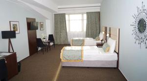 Ένα ή περισσότερα κρεβάτια σε δωμάτιο στο Hotel Class