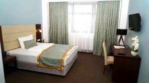 Ένα ή περισσότερα κρεβάτια σε δωμάτιο στο Hotel Class