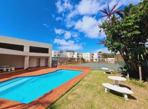 a swimming pool in the backyard of a house at 13 Chesapeake Bay in Margate