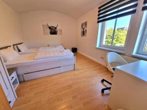 Postel nebo postele na pokoji v ubytování Fewo Anne, großzügige Wohnung