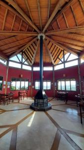 a large room with a stove in the middle of it at Pousada Quinta da Serra in Cunha