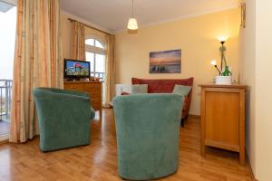 TV a/nebo společenská místnost v ubytování Apartmenthaus Atlantik Apartmenthaus Atlantik 212