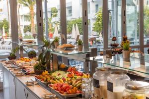 a buffet line with many different fruits and vegetables at Oasis Lanz Beach Mate in Costa Teguise