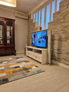 TV a/nebo společenská místnost v ubytování Zante Apartment