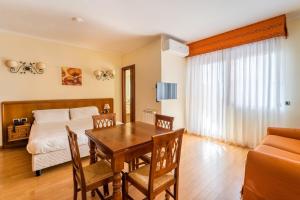 Voodi või voodid majutusasutuse Altea Suites toas