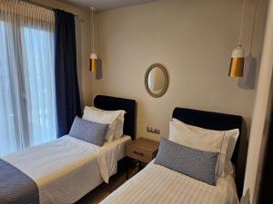 A bed or beds in a room at OLYMPUS Paradise 6