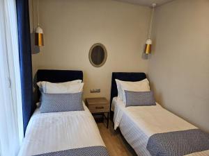 A bed or beds in a room at OLYMPUS Paradise 6