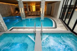a pool in a hotel with two swimming pools at Monthez Hotel & Eventos in Brusque +120 photos
