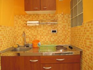 Kuchyňa alebo kuchynka v ubytovaní Apartment Villa Edmea
