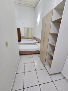 Rúm í herbergi á Hotel Marambaia Ponta Porã