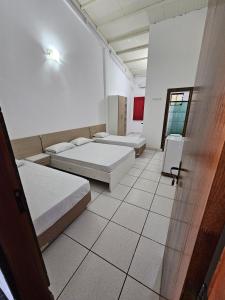 Rúm í herbergi á Hotel Marambaia Ponta Porã