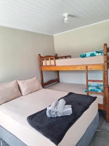 Postel nebo postele na pokoji v ubytování Apê Lagoamar 2