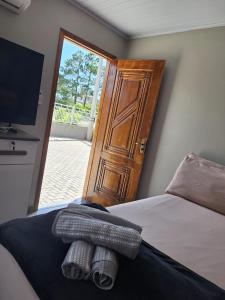Postel nebo postele na pokoji v ubytování Apê Lagoamar 2 + 24 fotografií