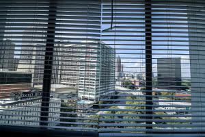 a view of a large city through a window at Highrise DTWN 3 Bed Condo w King Bed in Atlanta
