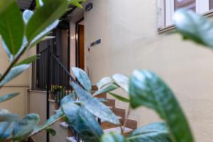 a staircase with green plants in front of a building at House Bossa in Nocera Inferiore