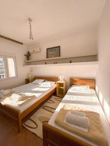 Postel nebo postele na pokoji v ubytování Ilijada Center